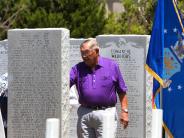 person looking at war memorial