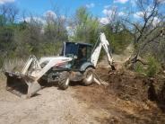 loader vehicle working on dirt